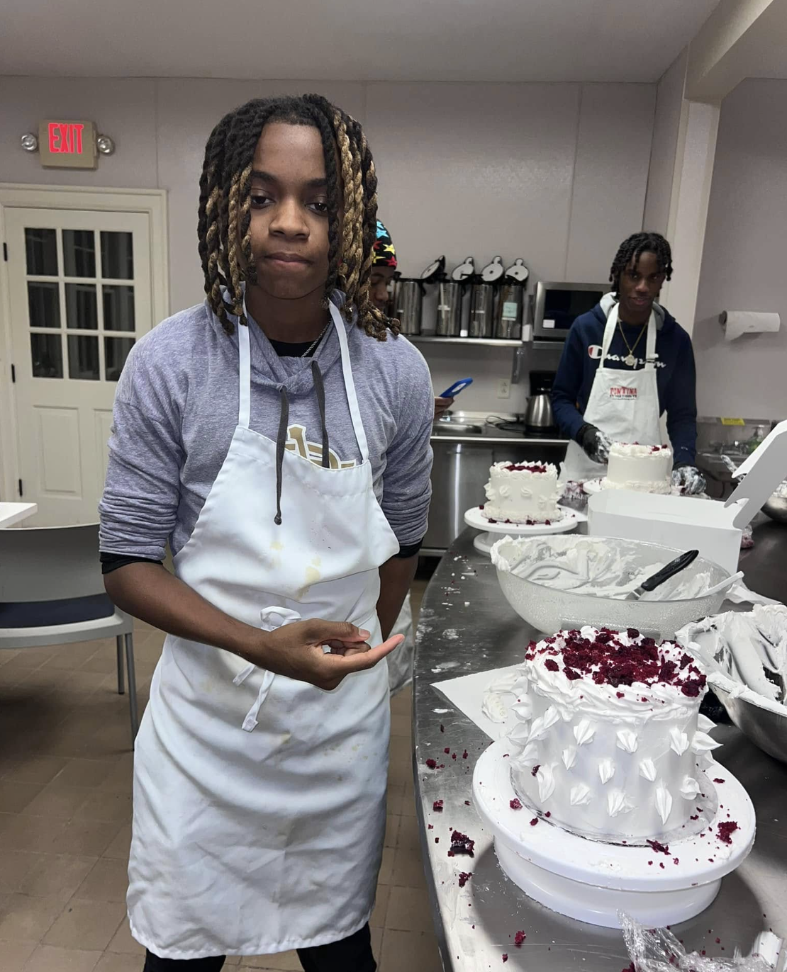 Community members raising a toast with dessert shooters