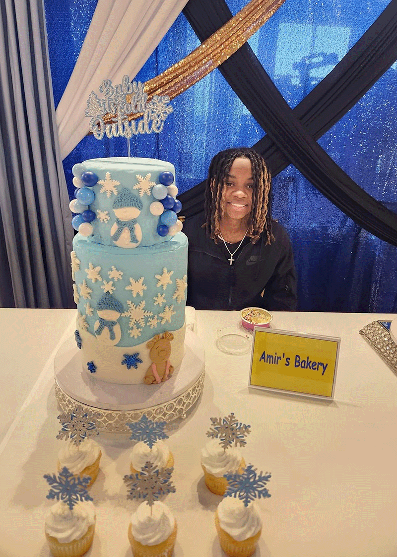 Closeup of gourmet cupcakes topped with fruit at the Syracuse Bakers Expo
